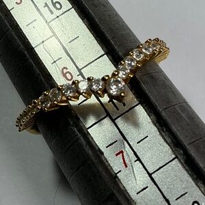 Sterling Silver gold tone V shaped ring with clear stones. Size 6